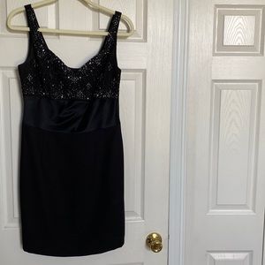 Black semi formal cocktail dress. Beaded at the top.